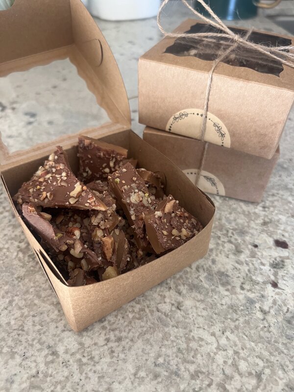 Close-up of chocolate almond toffee in kraft box